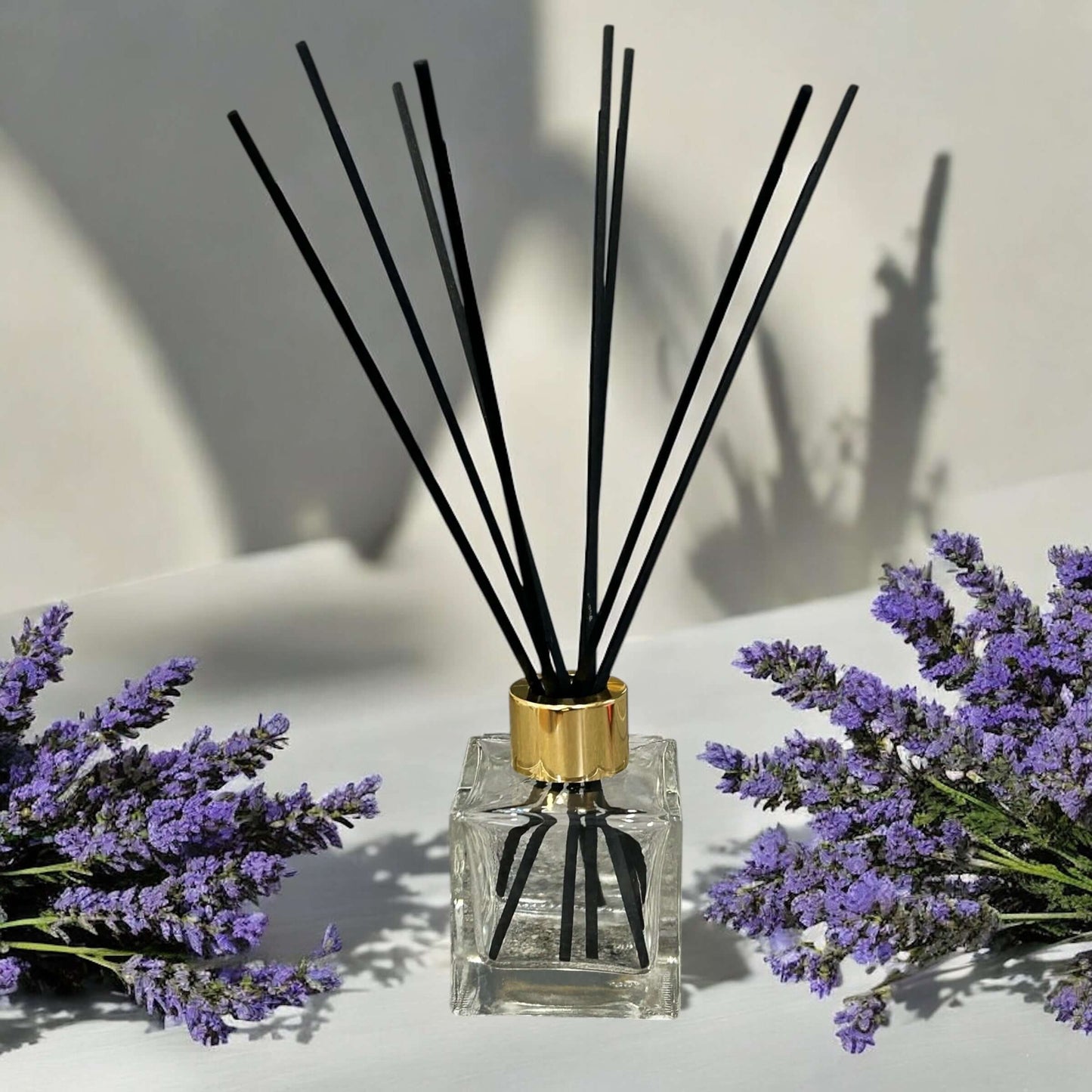Lavender spa reed diffuser in glass bottle with black reeds, vegan friendly and handmade.