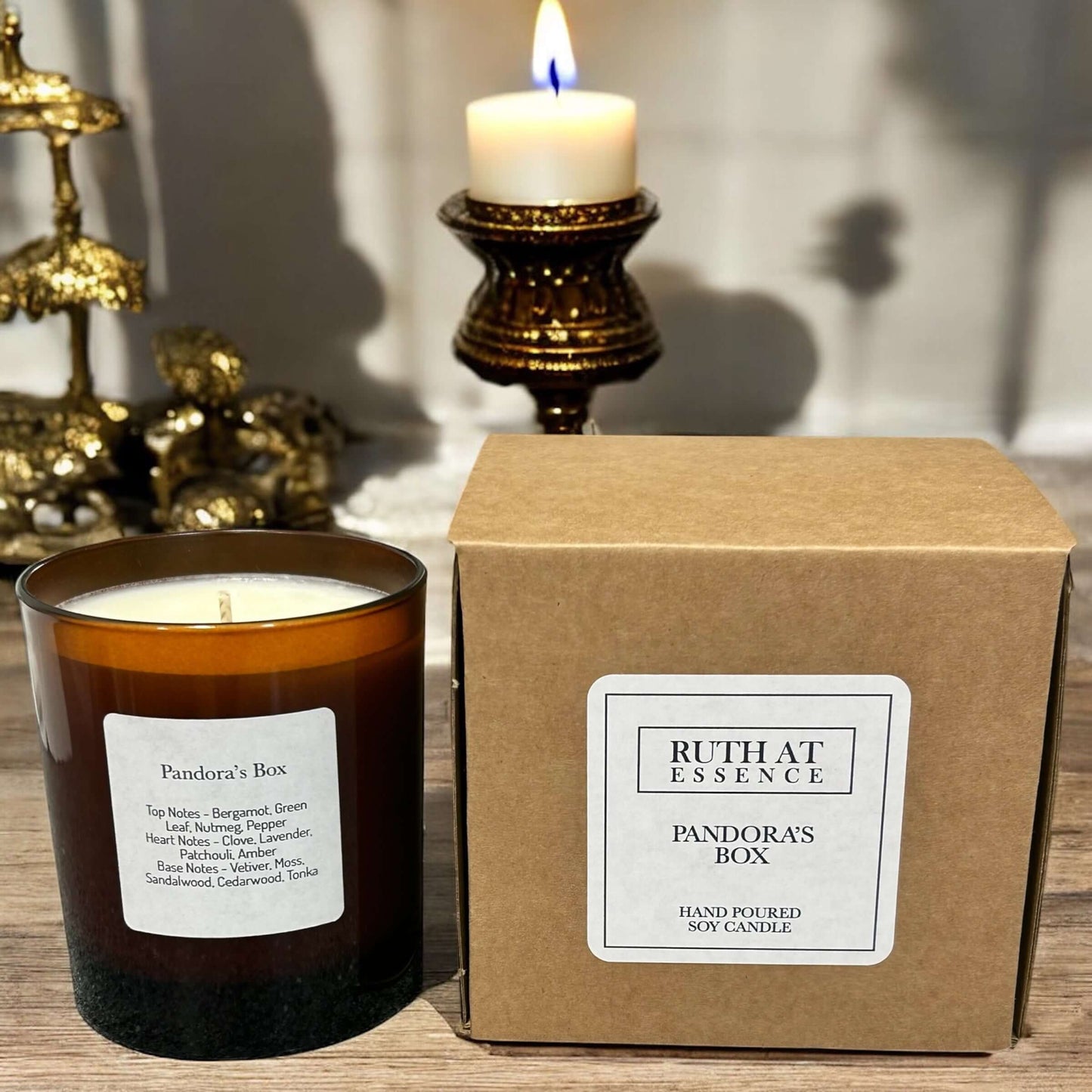 Handmade Pandora's Box candle in amber glass jar with eco-friendly packaging, vegan friendly, perfect for cozy evenings.