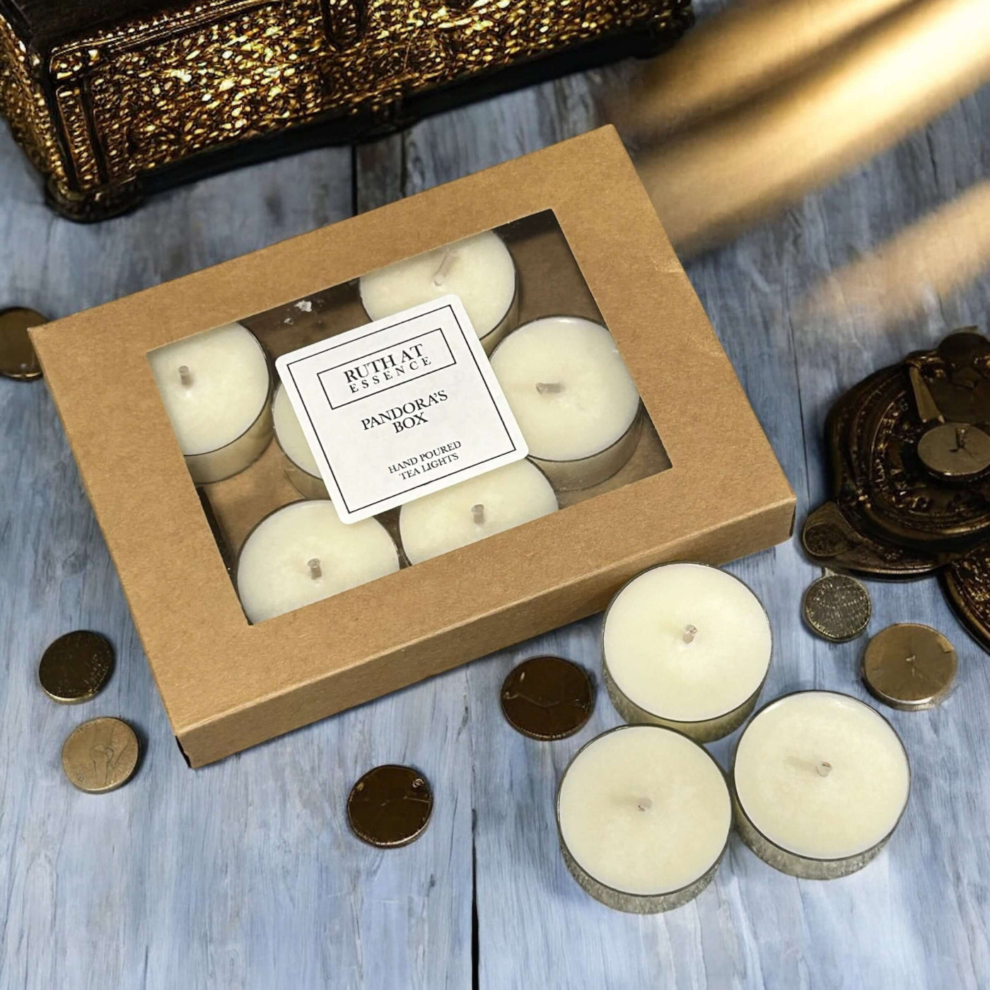 Handmade Pandoras Box tea lights in a kraft box, vegan friendly with delicate citrus and spice aroma.