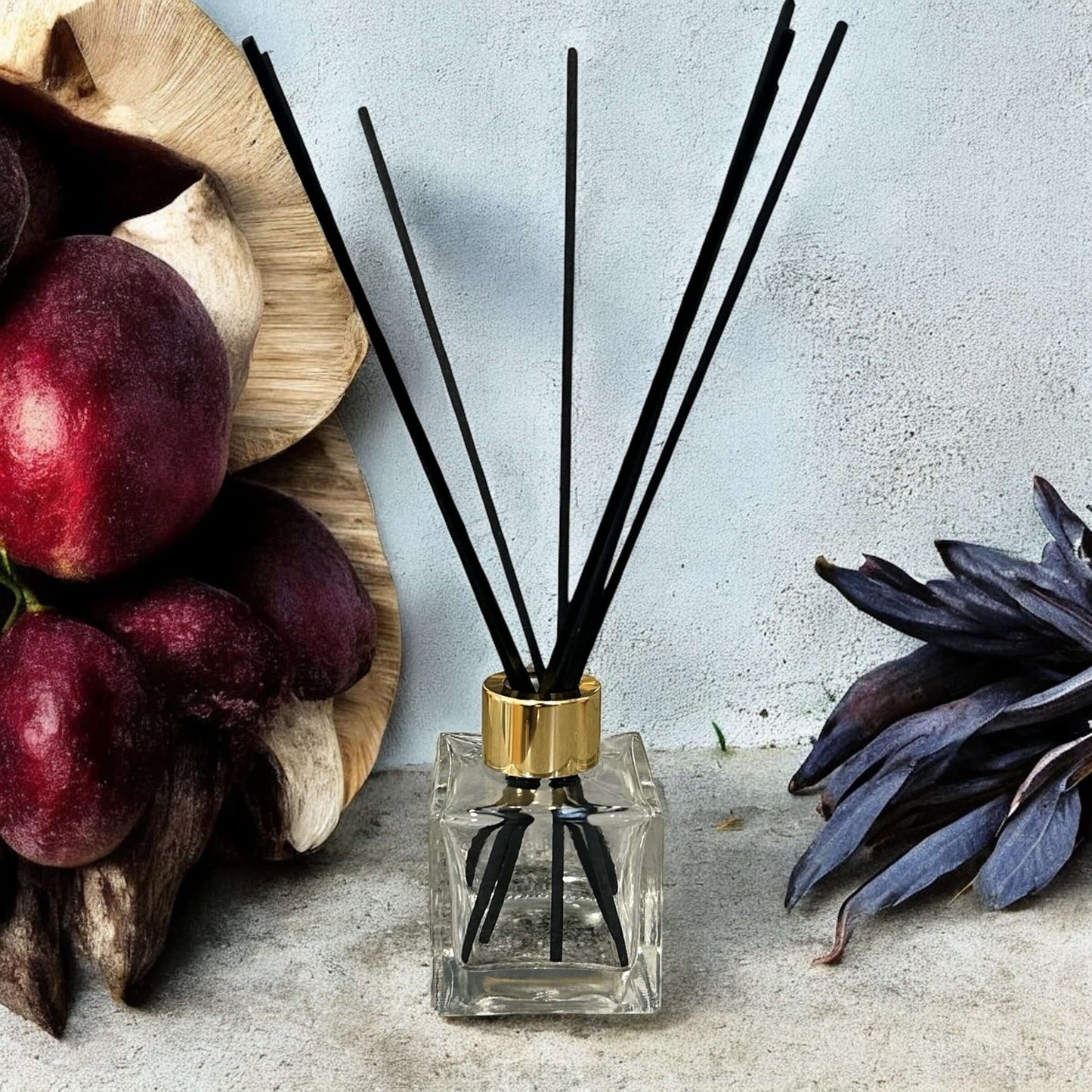 Black Plum & Rhubarb reed diffuser refill with black reeds, handmade and vegan friendly.