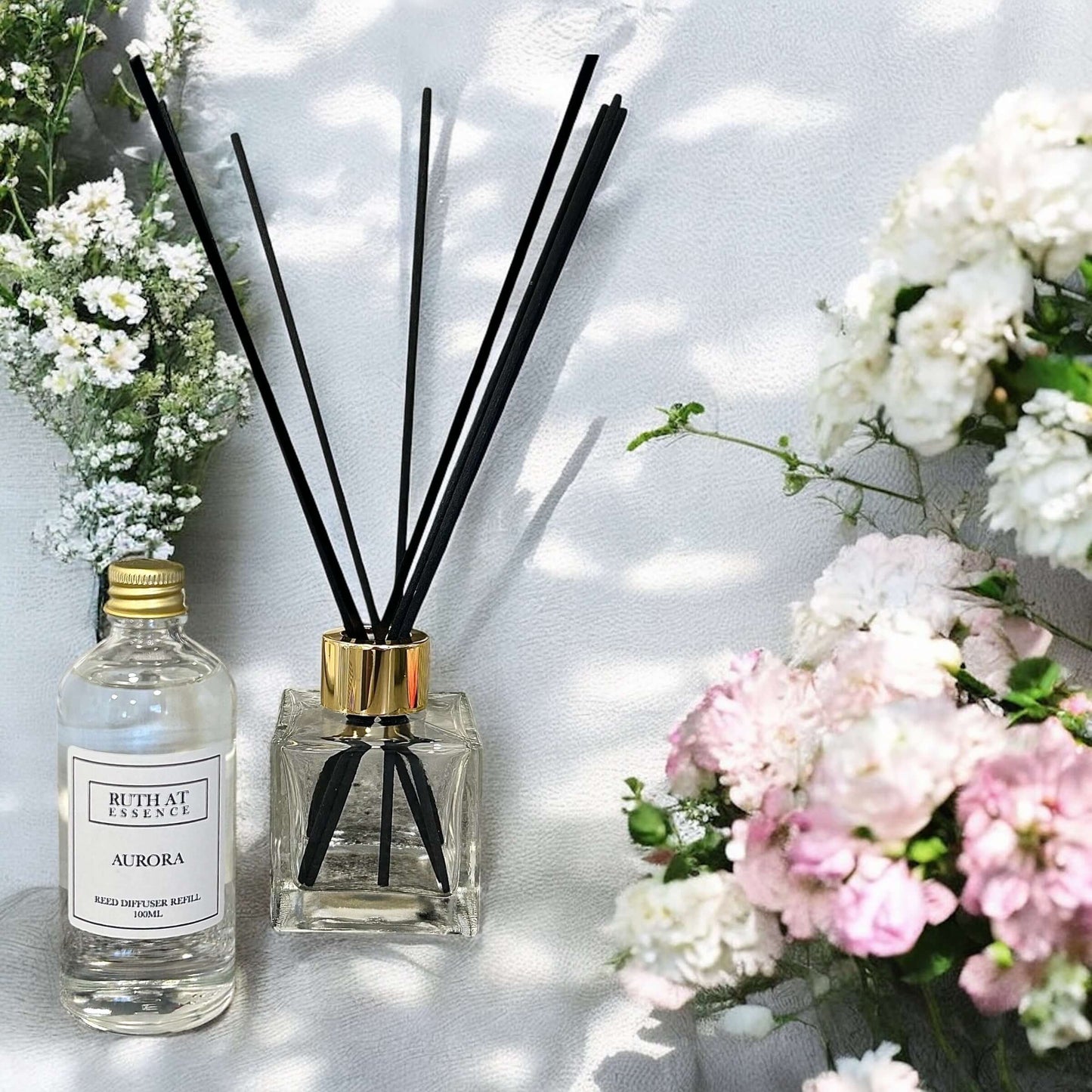 Aurora Diffuser Refill 100ml with black reeds and flowers, handmade, vegan friendly candle scent.