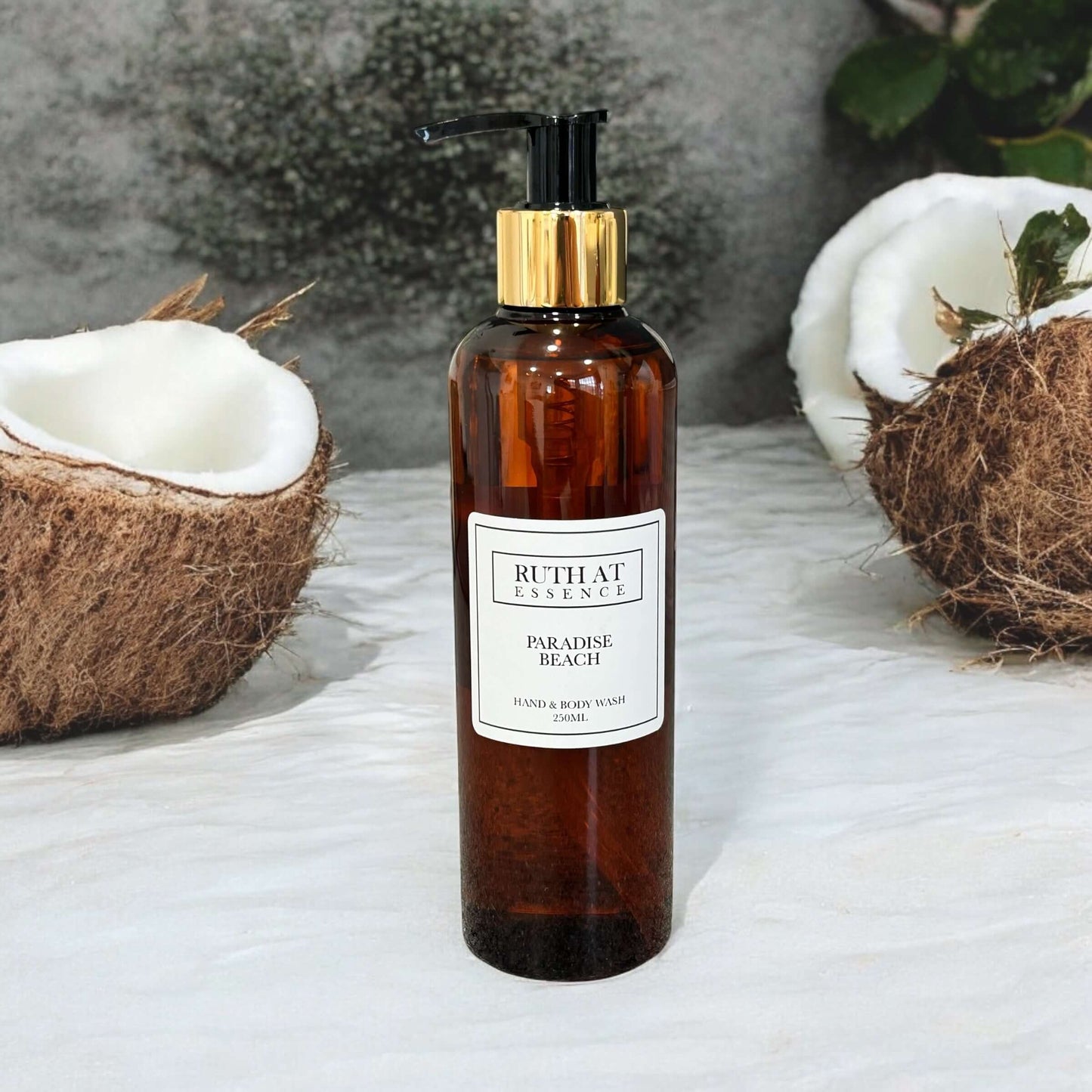 Paradise Beach Hand & Body Wash 250ml in amber bottle, vegan friendly, with fresh beach scent of vanilla and coconut.