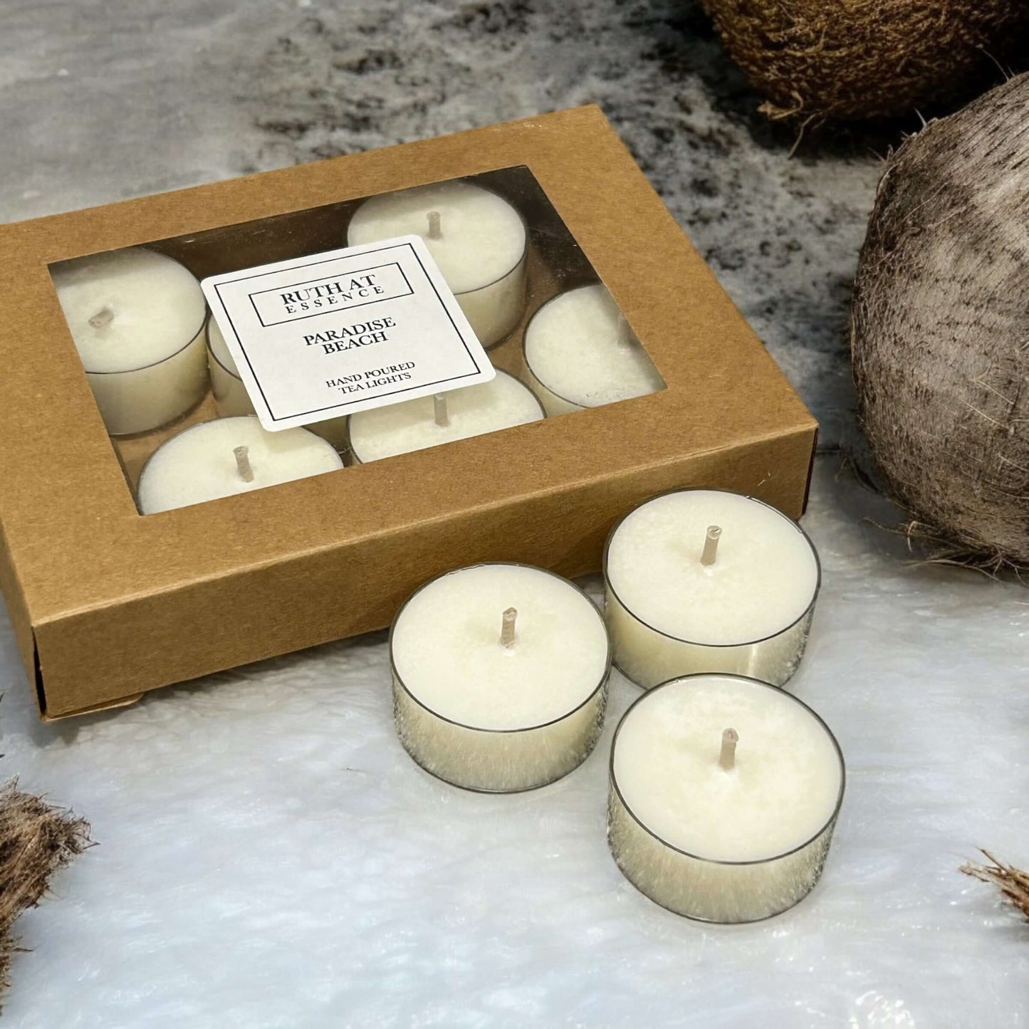 Handmade Paradise Beach tea lights box with 9 vegan friendly candles, infused with fresh coconut and ocean air.