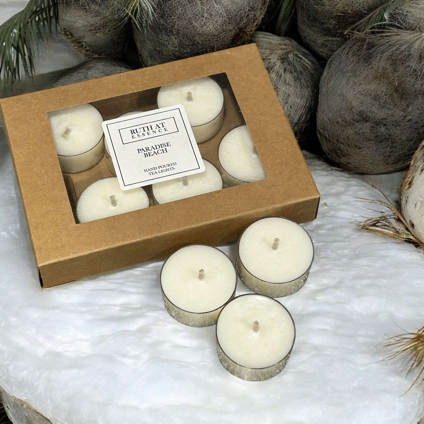 Handmade Paradise Beach tea lights box with 9 vegan-friendly candles infused with sweet vanilla, coconut, and bergamot.