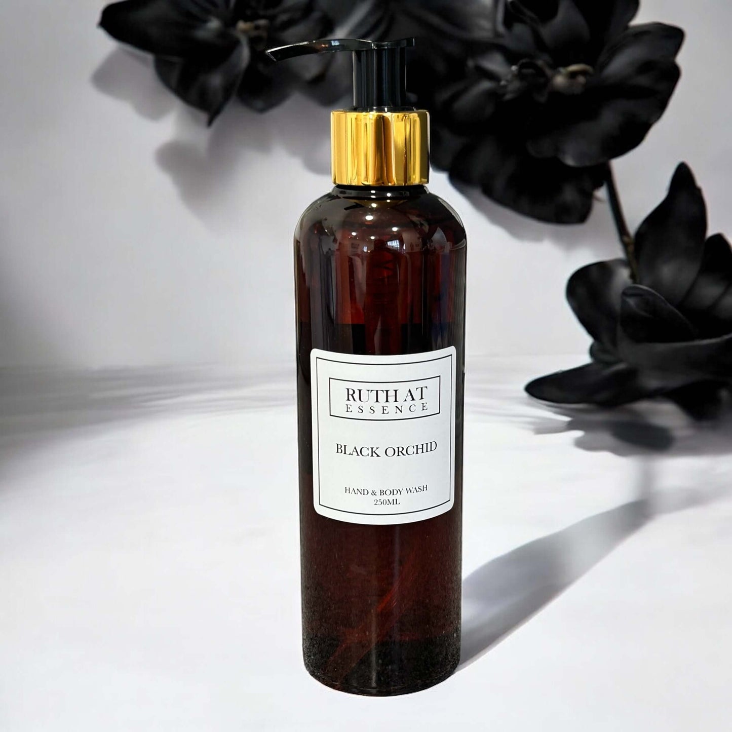 Black Orchid Hand & Body Wash 250ml in elegant amber bottle, vegan friendly, with luxurious fragrance.