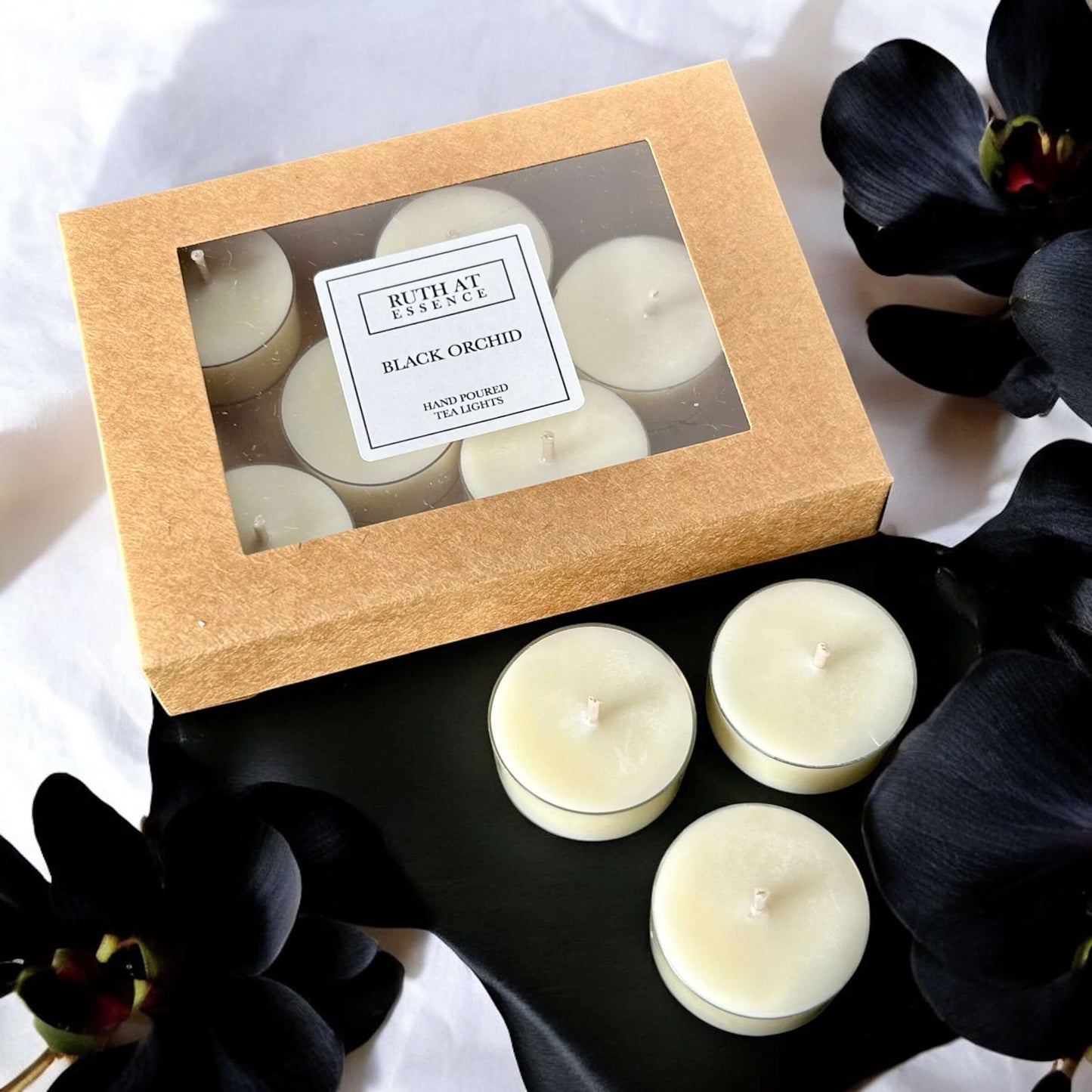 Handmade Black Orchid tea lights box containing 9 vegan-friendly candles with opulent scent and 4 hours burn time.