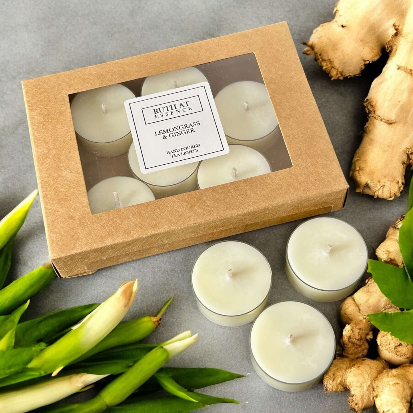 Handmade vegan-friendly lemongrass and ginger tea lights set in a box, featuring fresh fragrances.