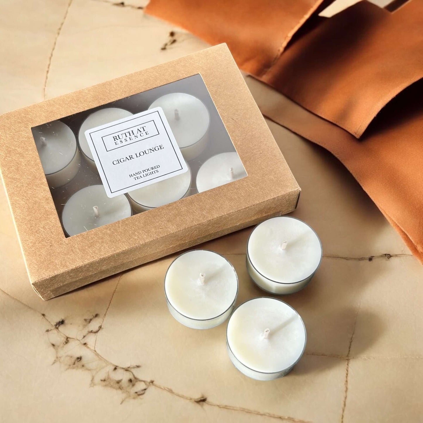 Handmade cigar lounge tea lights box with 9 vegan-friendly candles and leather accents, offering a smoky fragrance.
