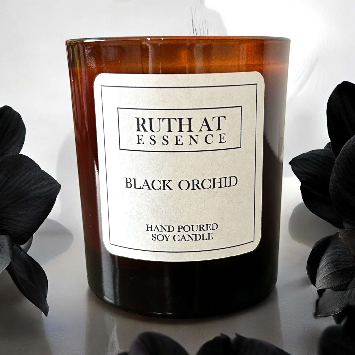 Handmade Black Orchid candle in glass jar, vegan friendly, featuring luxurious scent blend of orchid and wood.