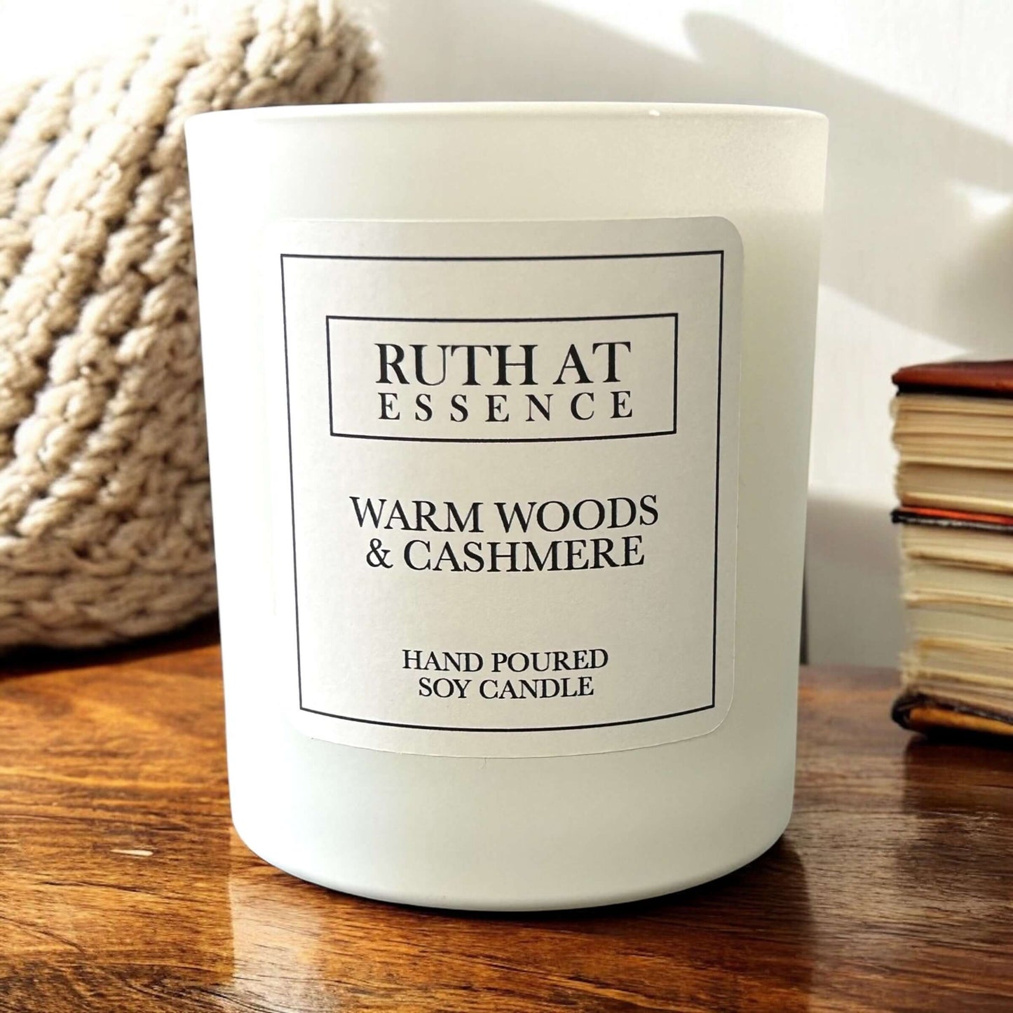 Hand poured vegan friendly Warm Woods & Cashmere candle in a white glass container.