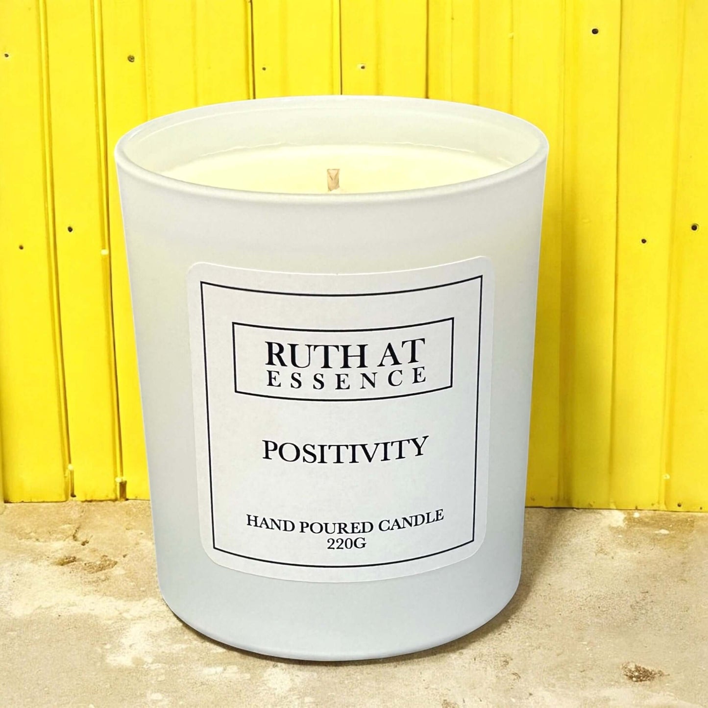 Handmade Positivity Candle 220g by Ruth at Essence, vegan-friendly with uplifting citrus and lavender scent.