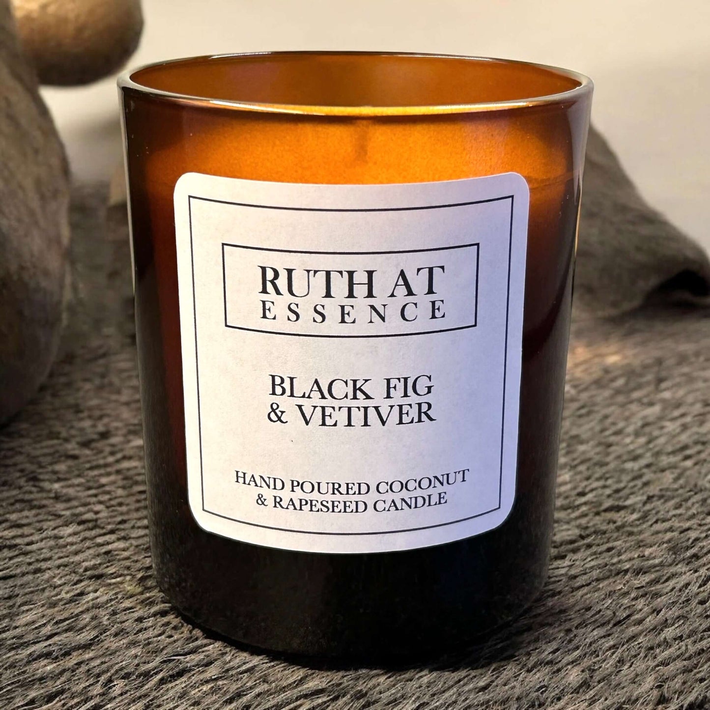 Handmade Black Fig & Vetiver candle in amber glass, vegan-friendly, hand poured with a cozy earthy fragrance.