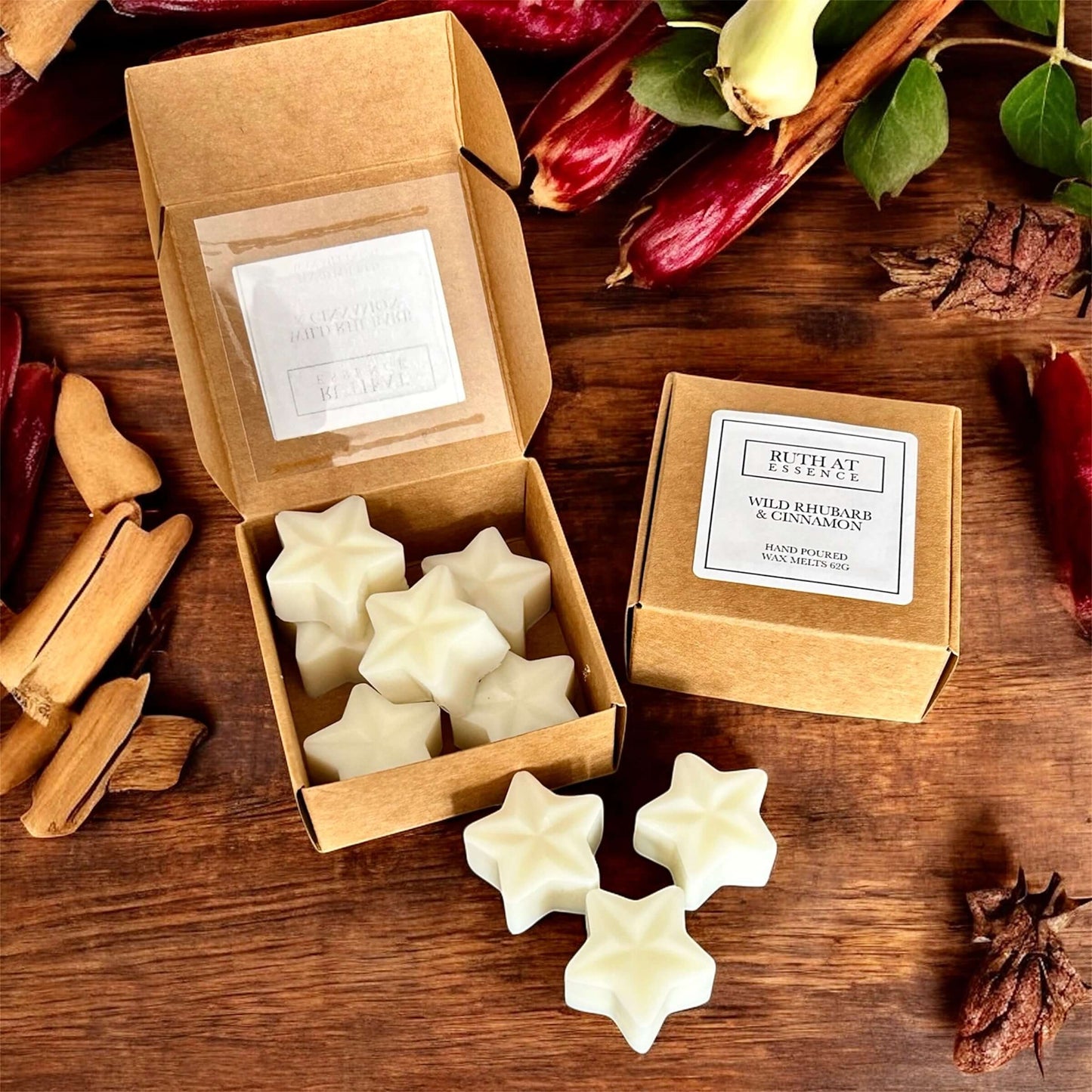 Wild Rhubarb & Cinnamon Wax Melts in star shapes, beautifully packaged for cozy fragrance and festive warmth.
