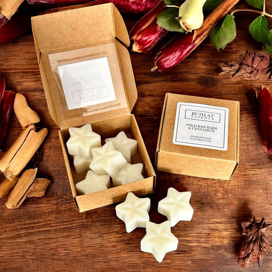 Wild Rhubarb & Cinnamon Wax Melts in star shapes, beautifully packaged for cozy fragrance and festive warmth.