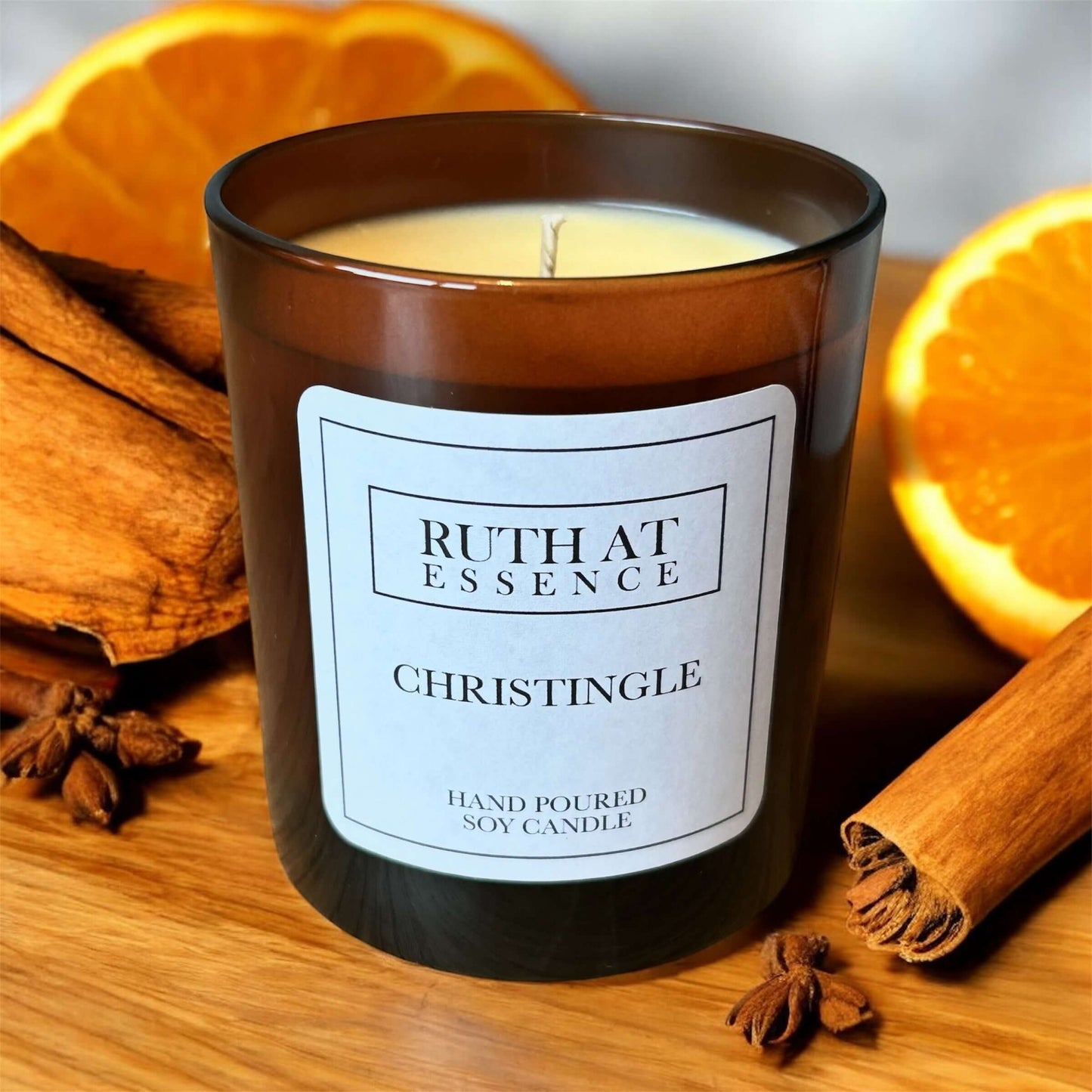 Christingle candle featuring warm cinnamon, clove, and orange scent, beautifully packaged in a hand-poured soy candle.
